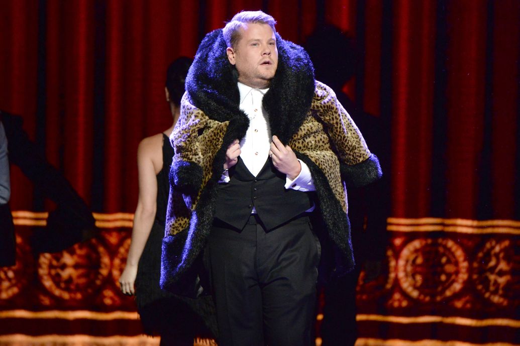 James Corden hosts the event in a bright outfit.