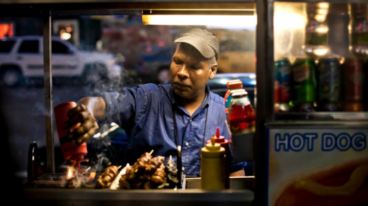 A New York City street vendor selling hot dogs.