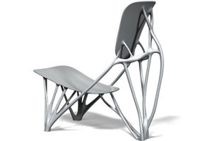A unique chair that appears to be made from bones. It's called "Bone Chair" and was designed by Joris Laarman.