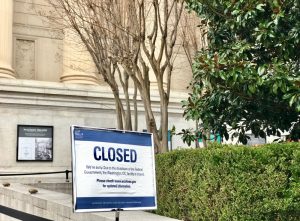 A sign posted outside the National Archives Museum that informs the public that the facility is closed due to the government shutdown.